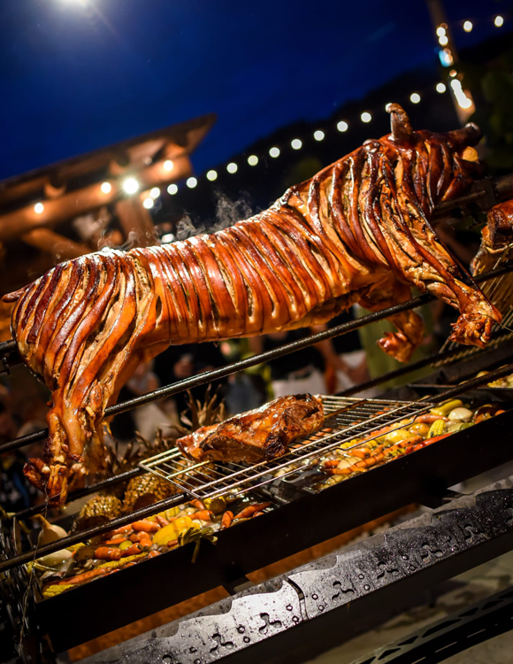 Whole fire-roasted pork at Can Bestia